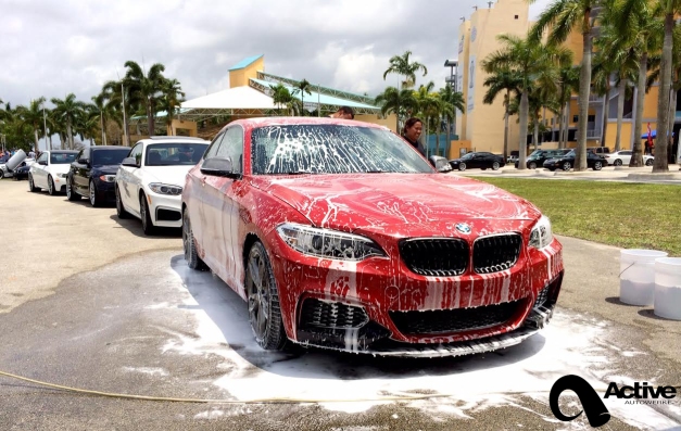 red 2 series getting washed at bmw event